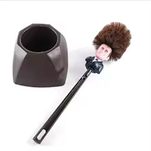 Emmanuel Macron toilet brush shown in use on toilet